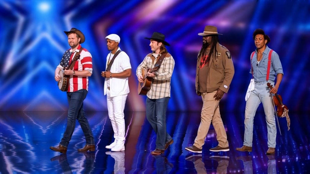 Five brothers performing a country song together on a talent-show stage