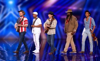 Five brothers performing a country song together on a talent-show stage